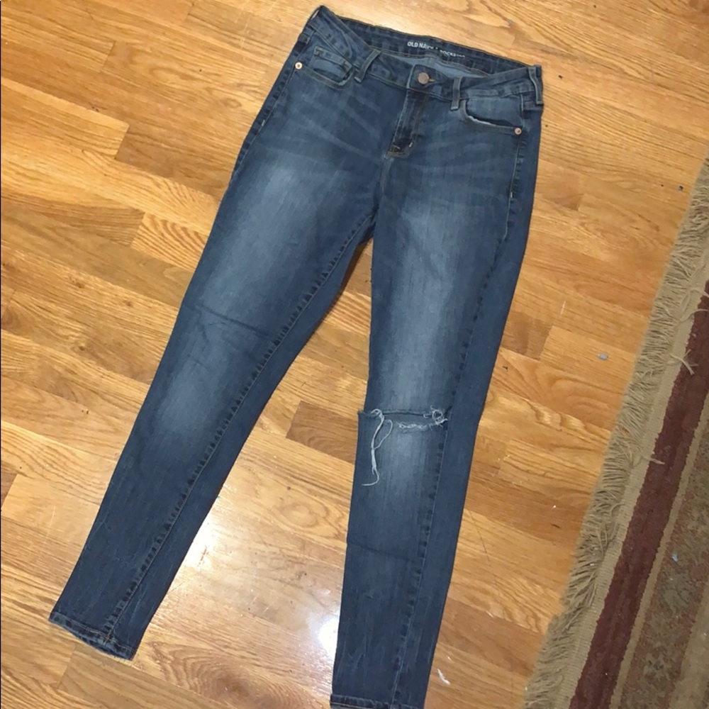 blue jeans with hole in one knee